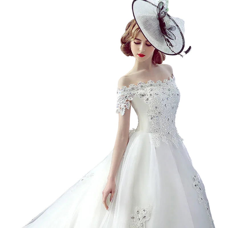 Elegant one-shoulder bridal gown with flowing train and French veil in milky white

