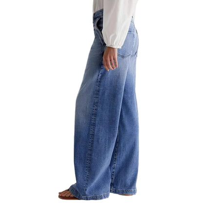 Wide leg embroidered denim jeans styled with white top and sandals