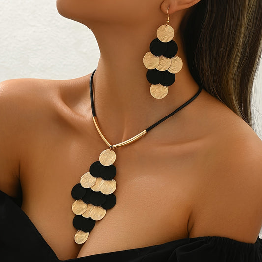 Gold and black circular pendant necklace and earrings 
