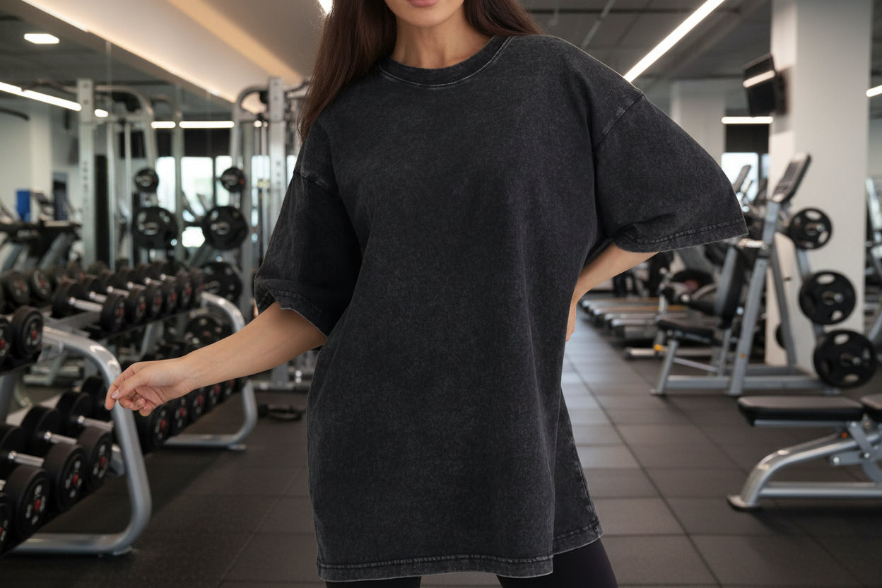 Person wearing a black oversized t-shirt 