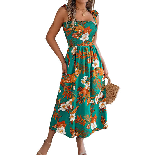 Green tropical floral midi dress with smocked corset bodice and adjustable tie straps — front view
