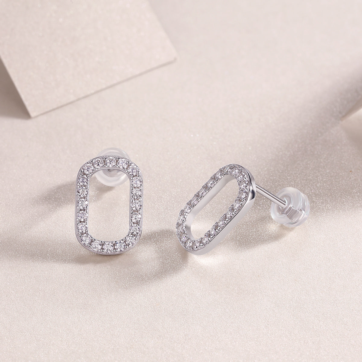 Elegant oval moissanite earrings with full diamond surround