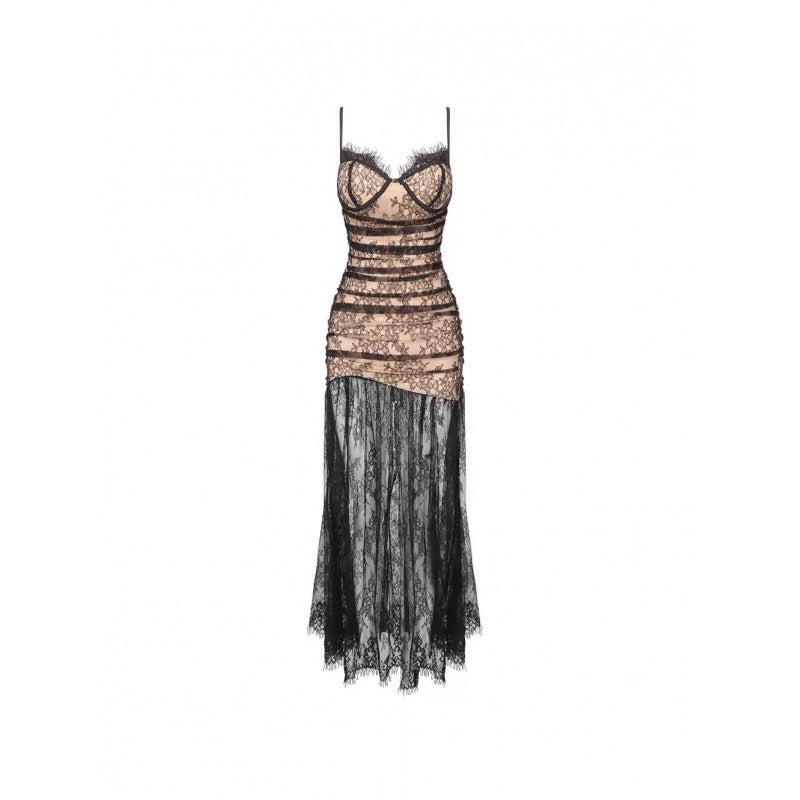 Black lace evening dress showing semi-sheer construction and dramatic floor-length silhouette