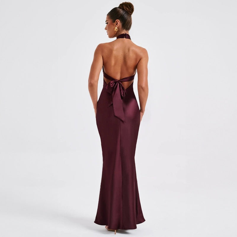 Women's backless satin evening dress with twisted halter neckline, back  view

