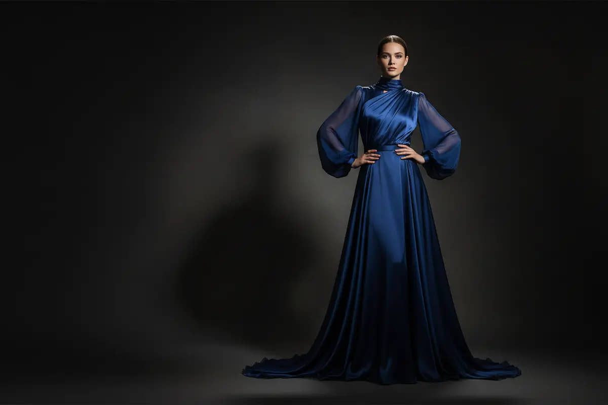 A woman with a very elegant long night blue dress 