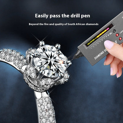 Diamond ring being tested with a diamond tester pen 