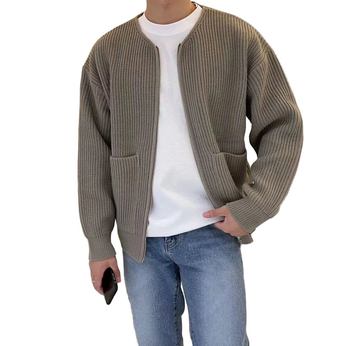 Close-up of zip closure and patch pocket detail on men's knit cardigan
