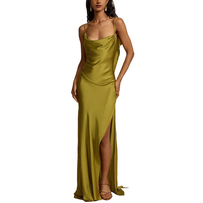 Woman wearing a green evening gown with a slit 