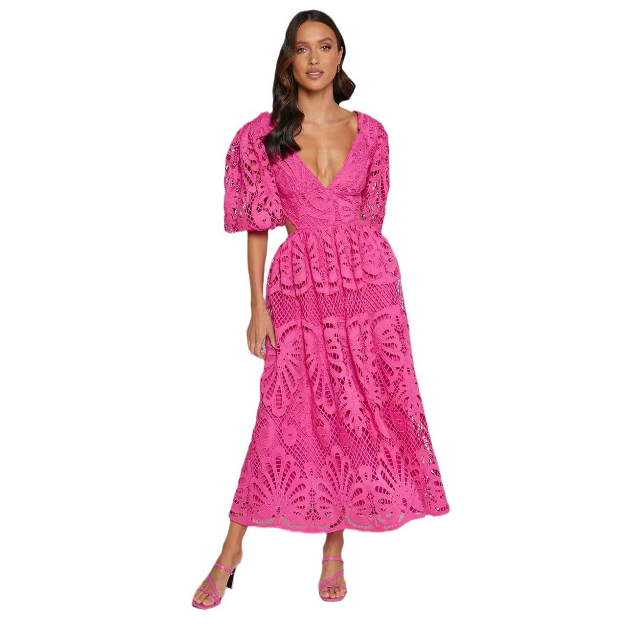 Woman wearing a pink lace dress with a v neck 