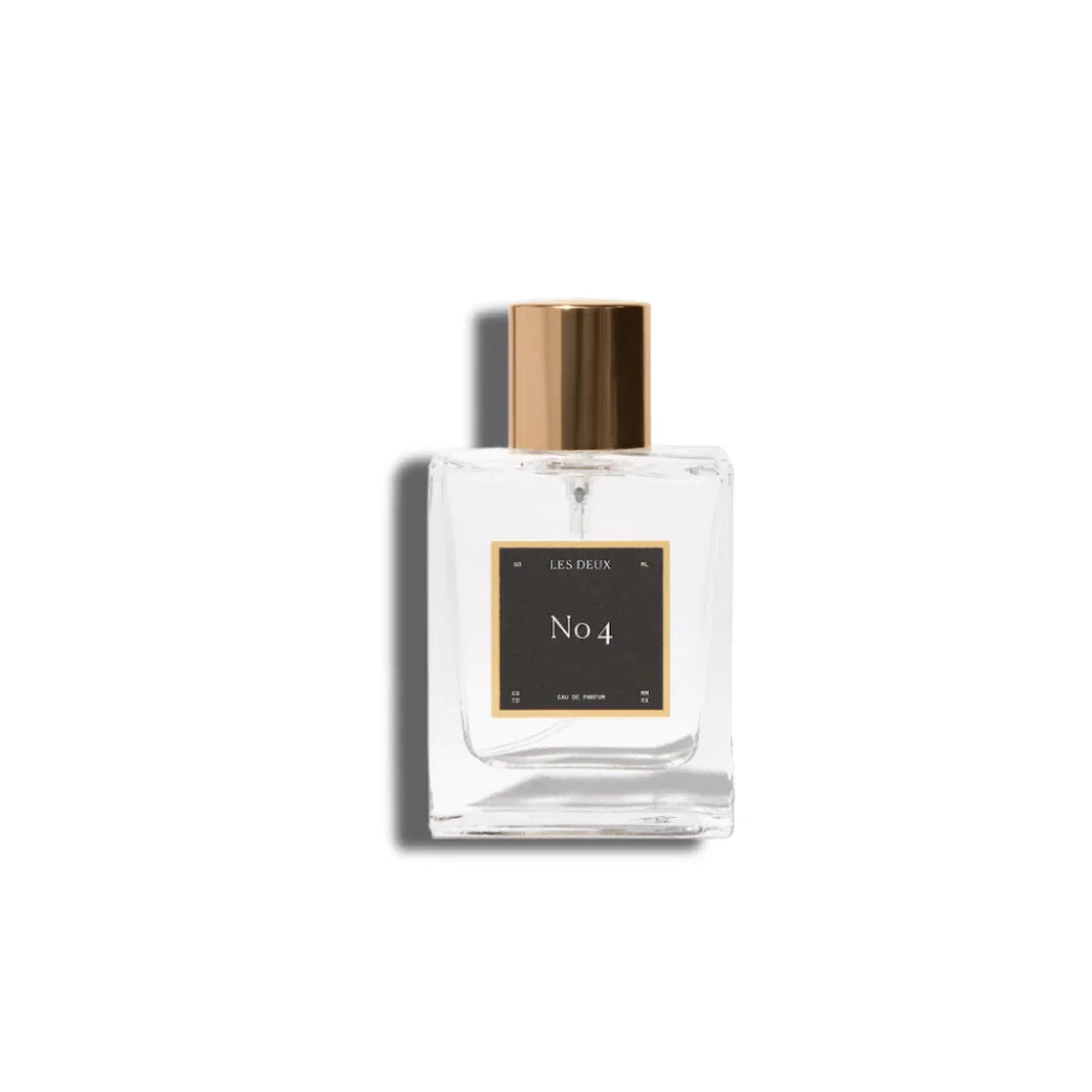 Perfume bottle with gold cap and clear glass body 