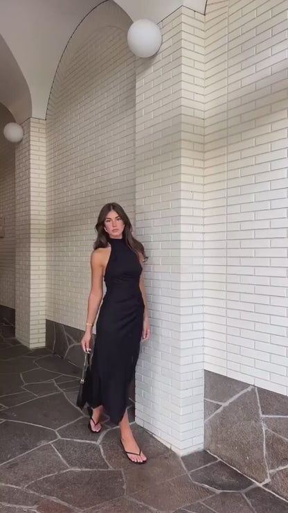 Backless halter long dress in green – rear view highlighting open back and halter neckline
