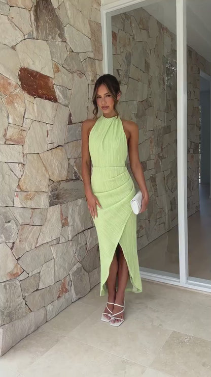 Green halter maxi dress with open back – side profile showing high waist and split hem
